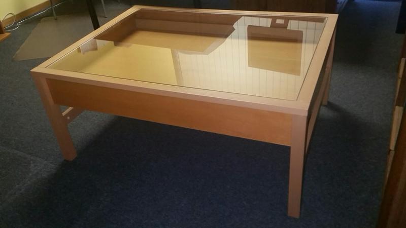Coffee Table with glass top and slide out storage