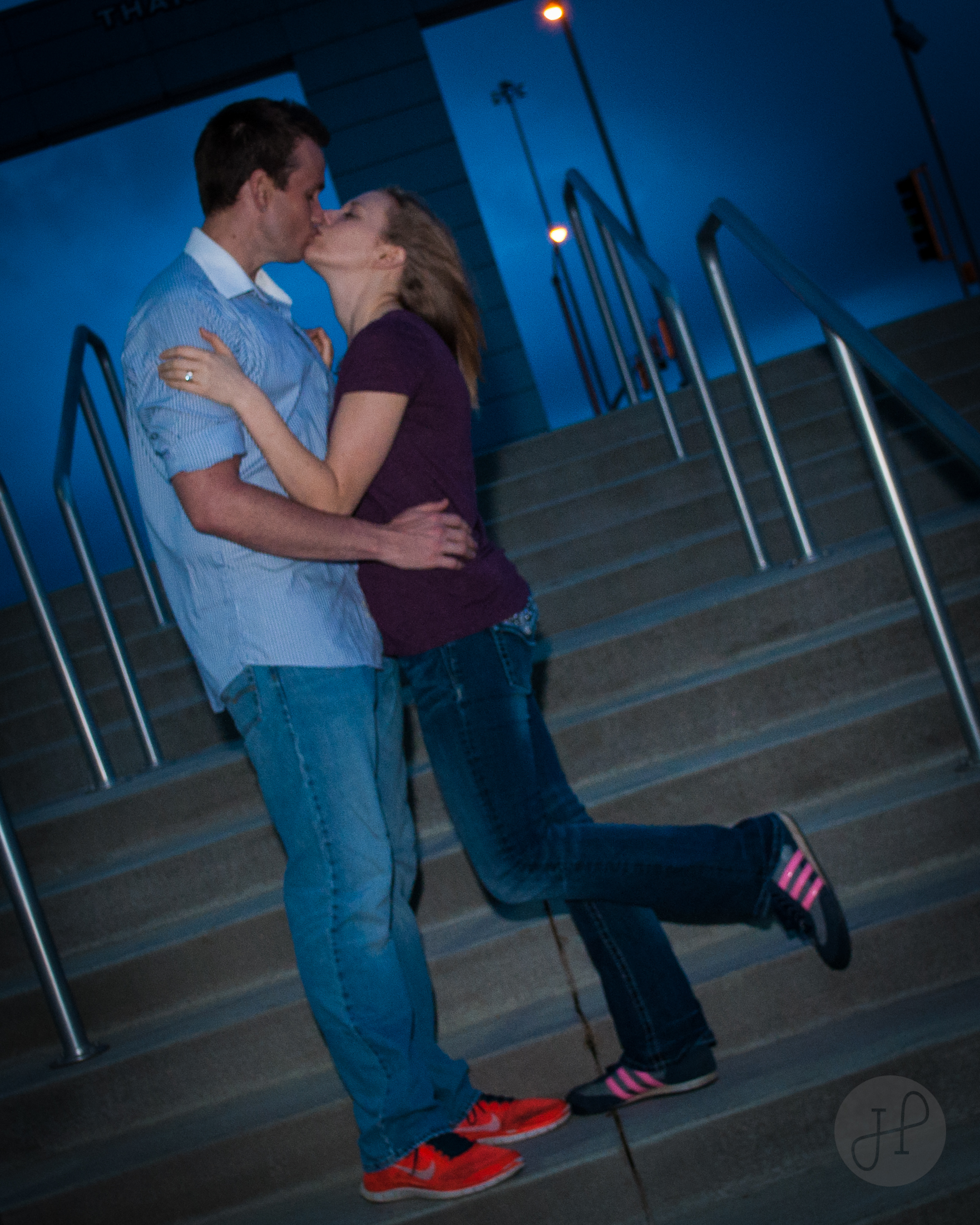 Photo of a couple kissing on stairs
