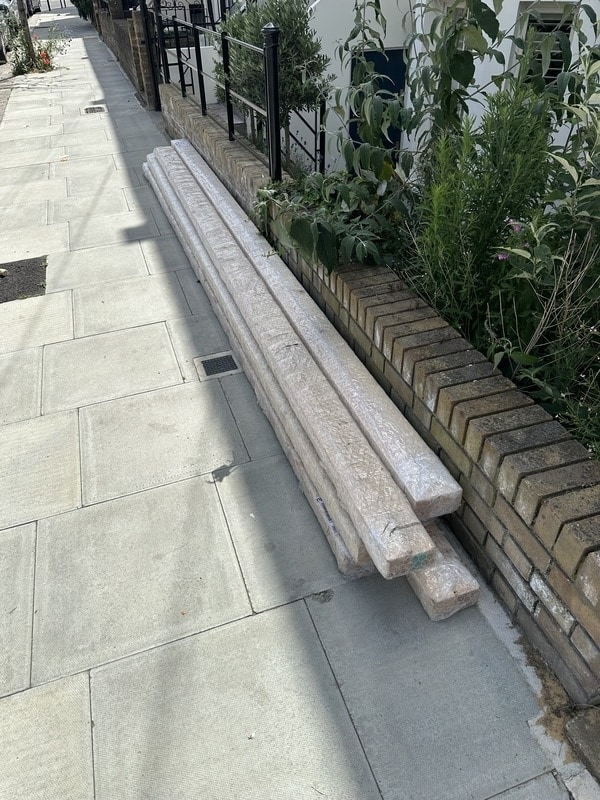 50 meters of wooden beams, packaged in bubble wrap, sitting on the kerb outside our flat.