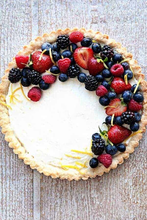 a pie with berries on top