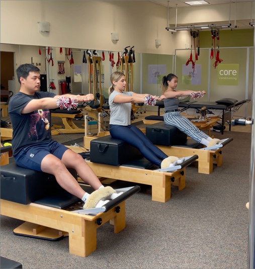 a group of people working out in a gym