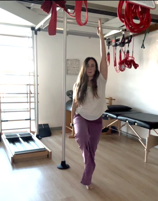 a woman standing on a bar