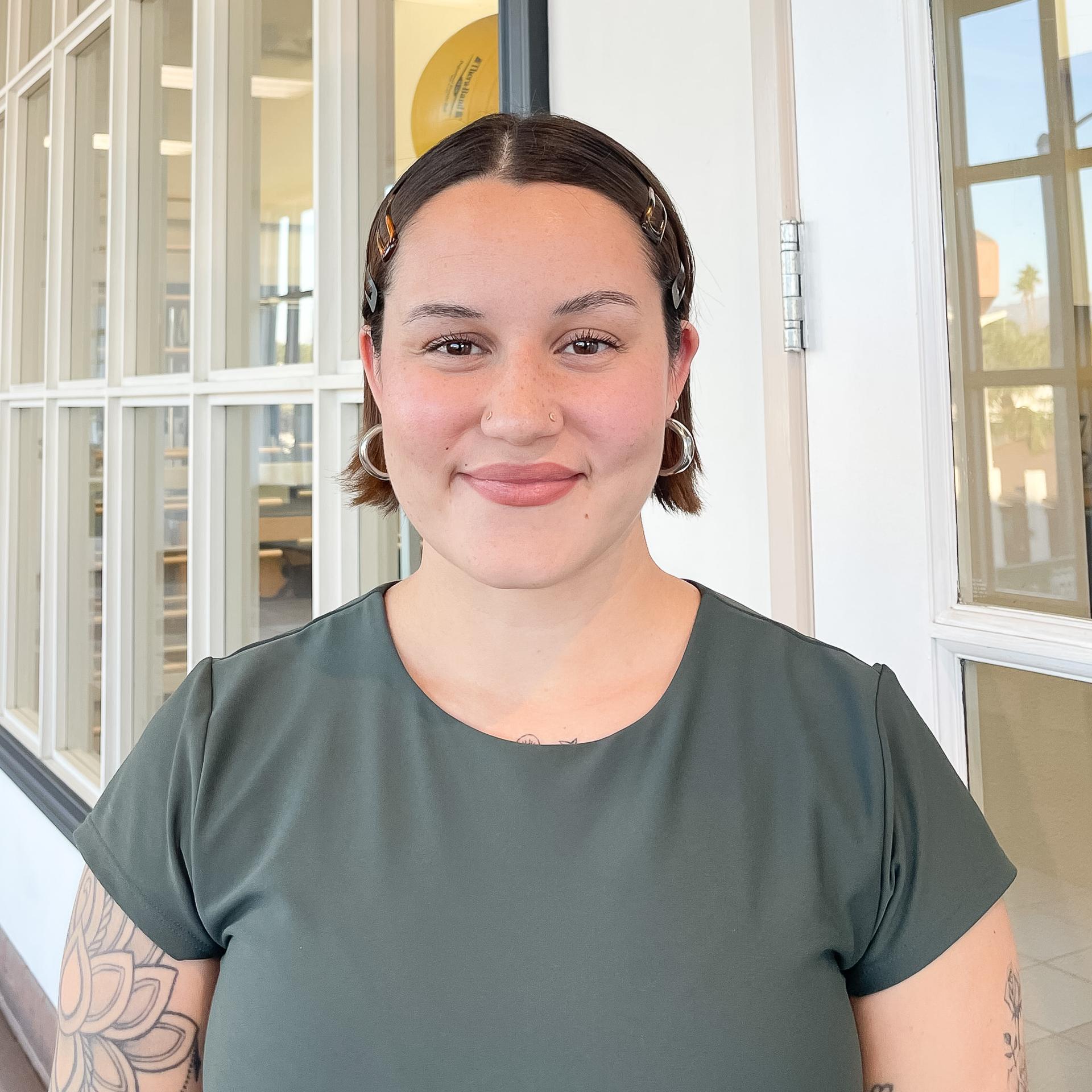 a woman standing on a bar