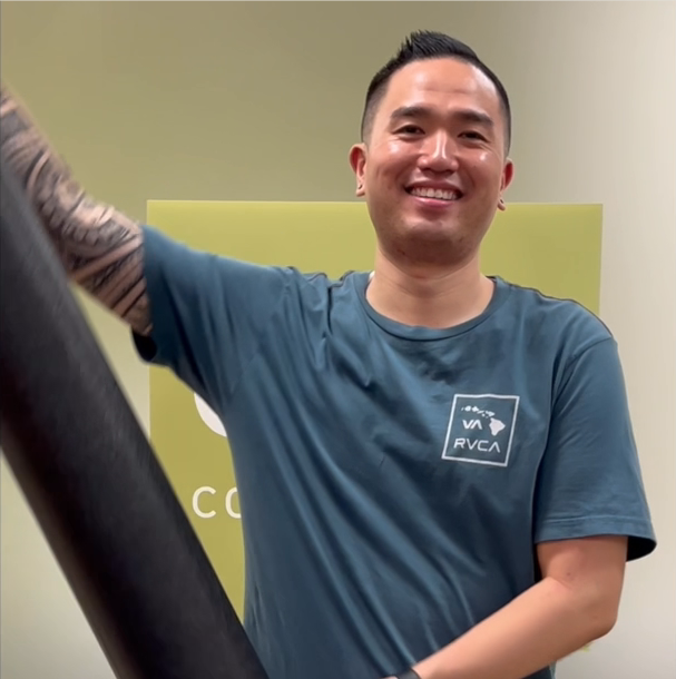 a man smiling with arm extended