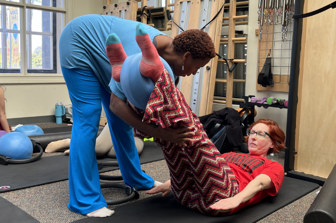 a woman lifting another woman