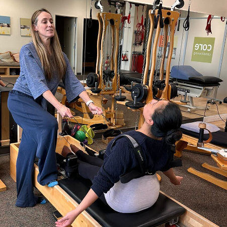 a woman sitting on a machine