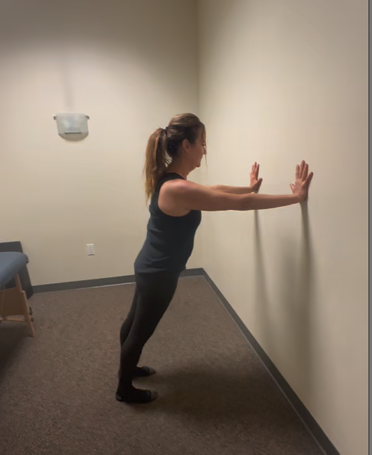 a woman holding a wall