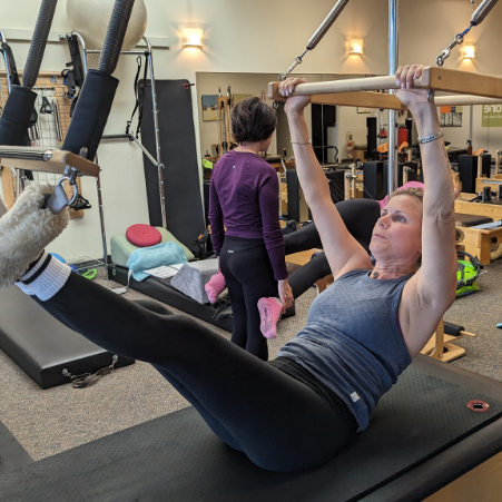 a woman sitting on a machine
