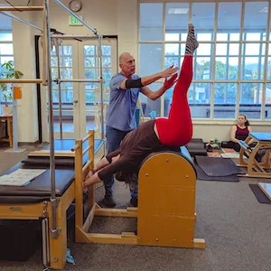 a woman sitting on a machine