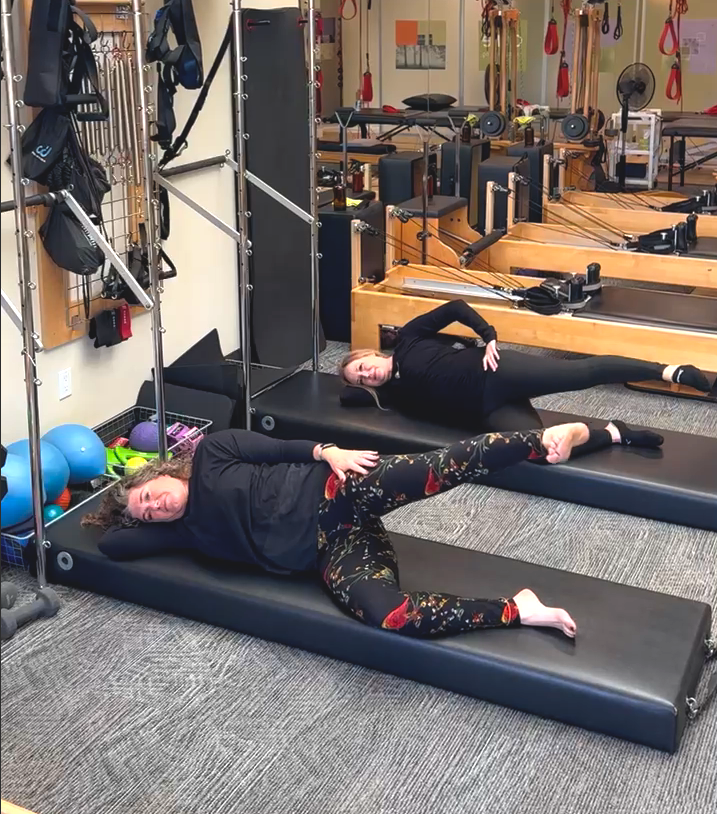 a group of people lying on mats