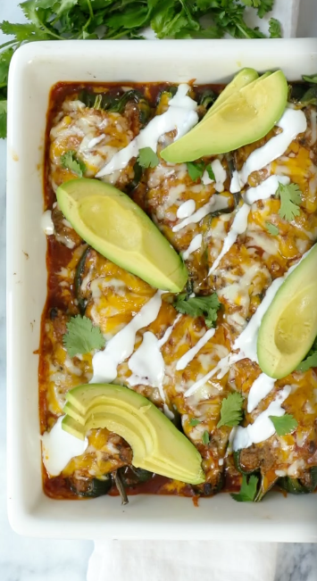 a casserole dish with avocado slices and cilantro
