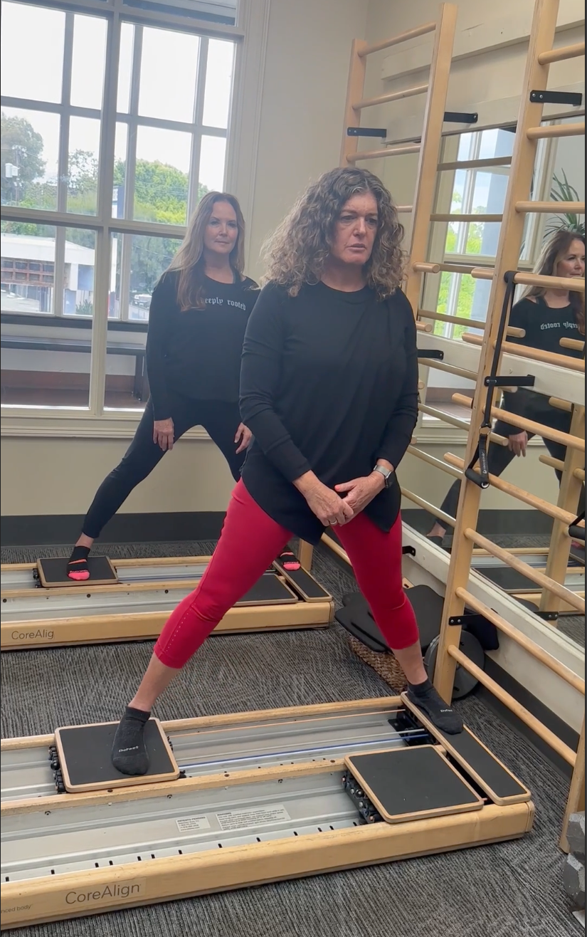 a group of women standing on CoreAlign machines