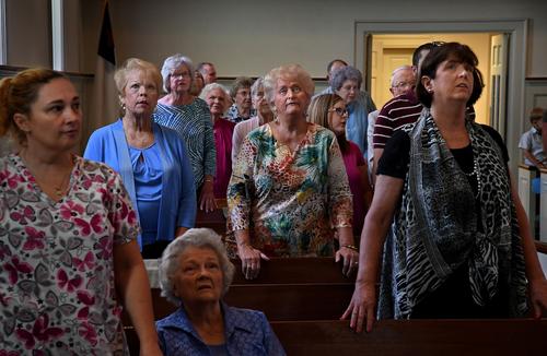 A congregation of White men and women worships at First Baptist Church in the town of Luverne, Alabama. 