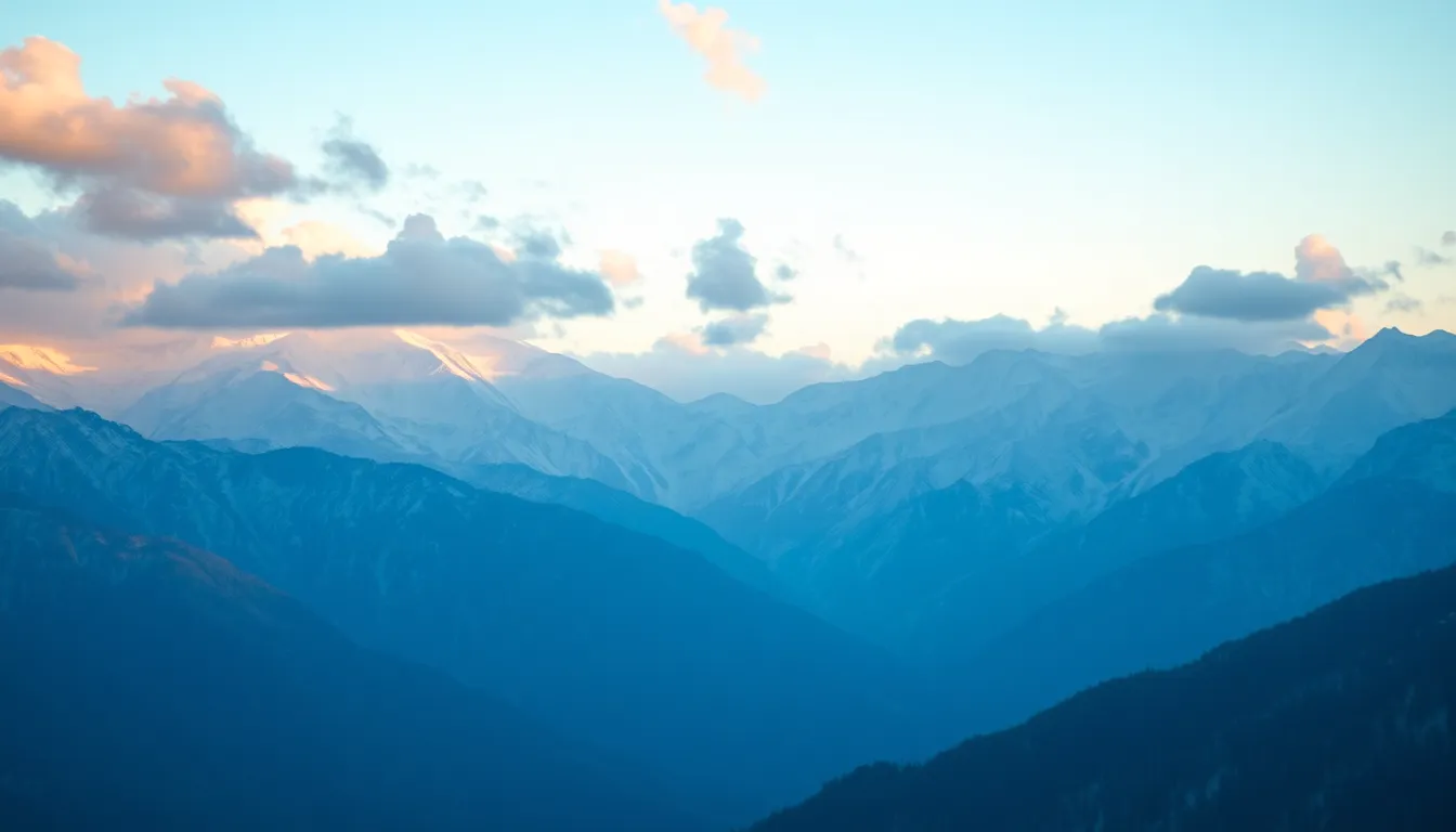 Serene Aerial View of Snow-Capped Mountain Range at Sunrise