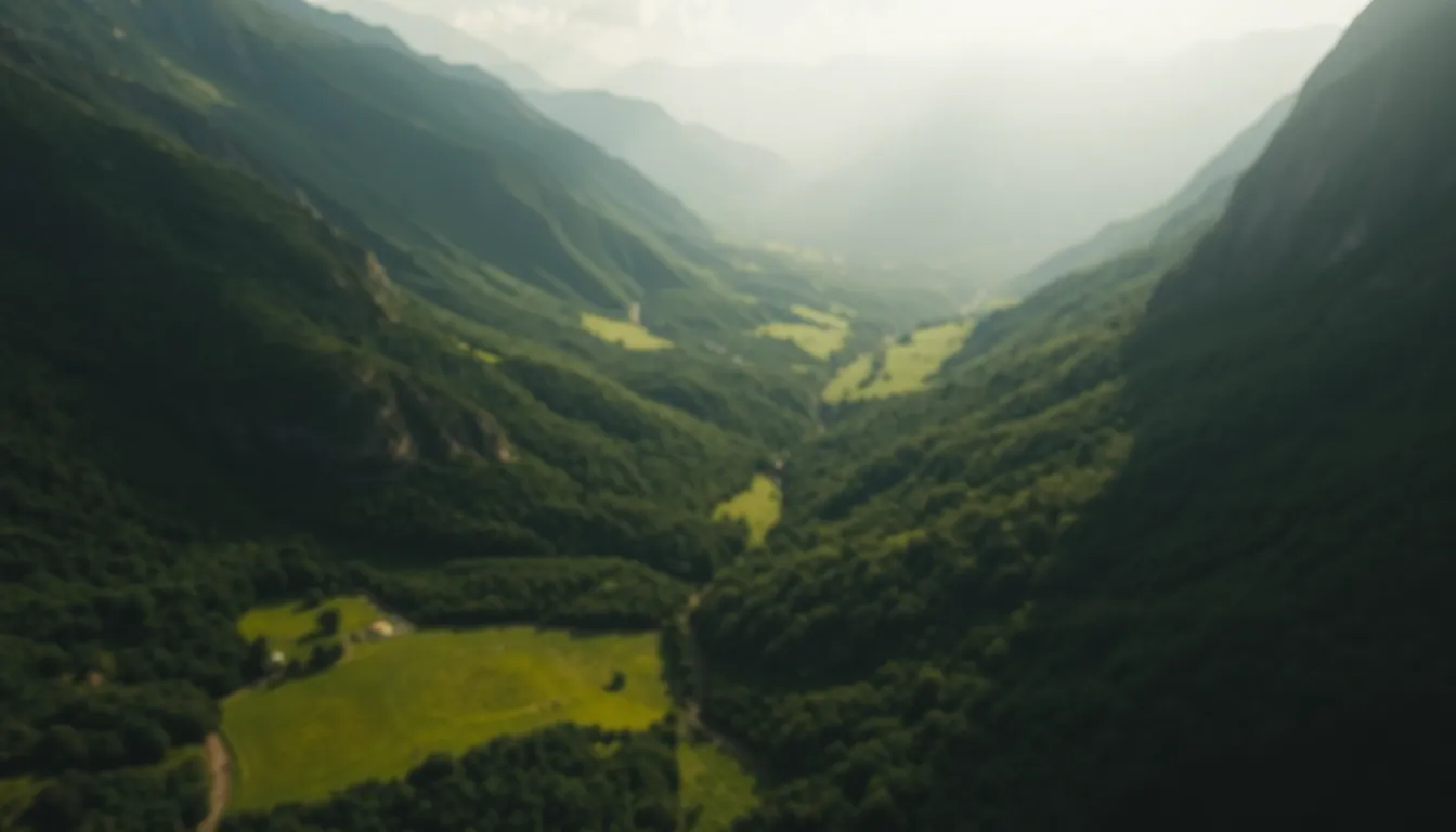 Aerial View of Lush Green Valley Surrounded by Mountains