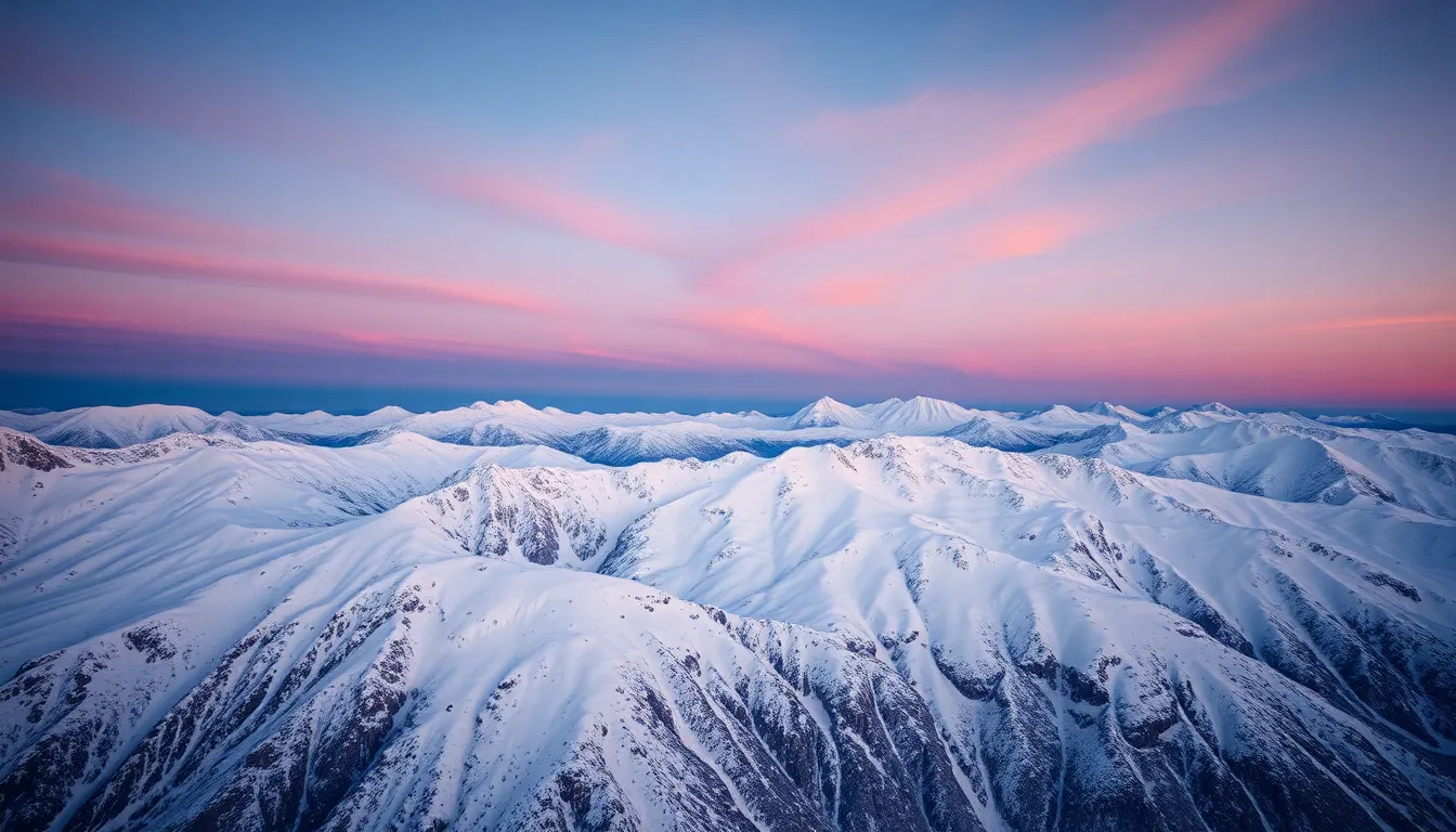 Twilight Aerial View of Snowy Mountains