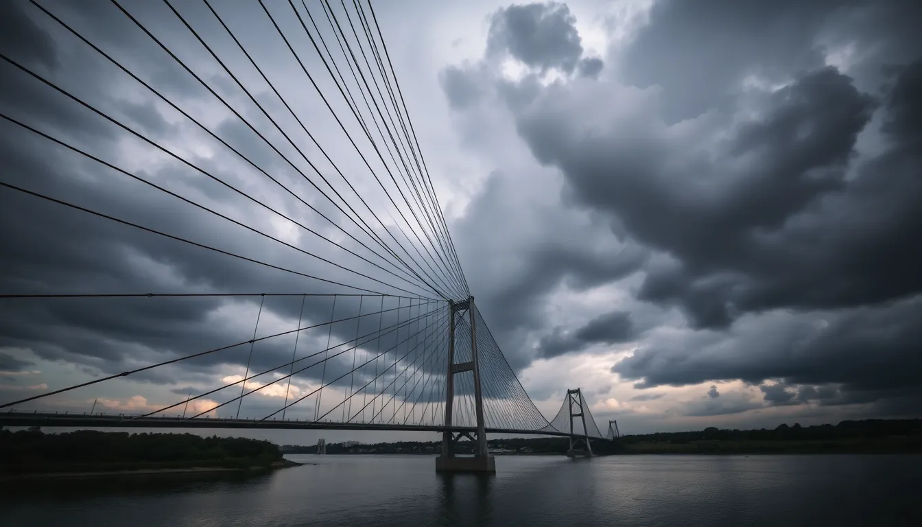 Stormy Bridge Under Dark Skies This striking image presents a steel cable bridge under an ominous stormy sky, with dark clouds swirling dramatically. The selective focus highlights the intricate patterns of the bridge's cables while leading lines invite the viewer's gaze across the river. Natural muted tones enhance the somber mood, creating a sense of impending weather. The reflections of the turbulent sky in the calm water below add to the tension of the scene, making it a captivating visual portrayal of nature and engineering.