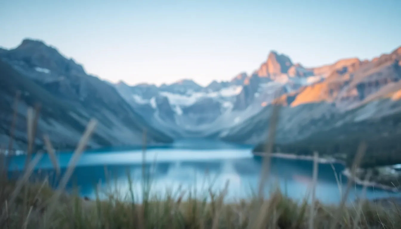 This mesmerizing aerial photograph captures a serene high-altitude mountain lake surrounded by rugged peaks during the tranquil blue hour of dawn. The soft blues and pastels create a calming atmosphere, perfectly reflecting the stillness of the water. The composition features the lake as a leading line that guides the viewer's gaze toward the dramatic mountain backdrop. This image beautifully encapsulates the majesty and serenity of nature's untouched landscapes.