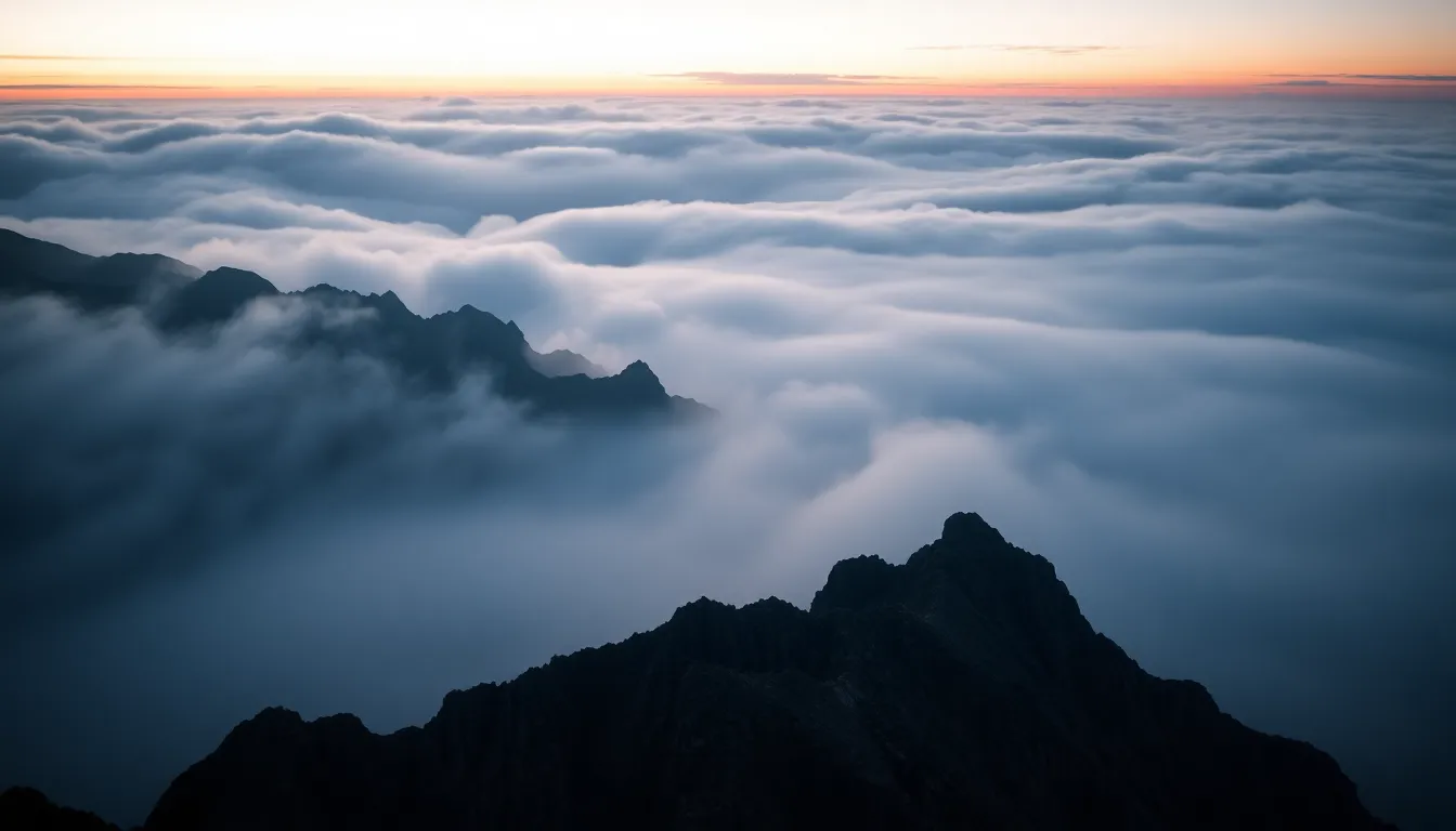 This breathtaking image showcases majestic mountain peaks enveloped in thick fog during twilight. The cool, desaturated tones create a dramatic mood, while the layers of fog weave through the ridges, adding depth to the scene. Sharp focus throughout highlights the rugged texture of the rocks juxtaposed against the soft mist. This visually stunning photograph encapsulates the beauty and mystery of nature's landscapes.