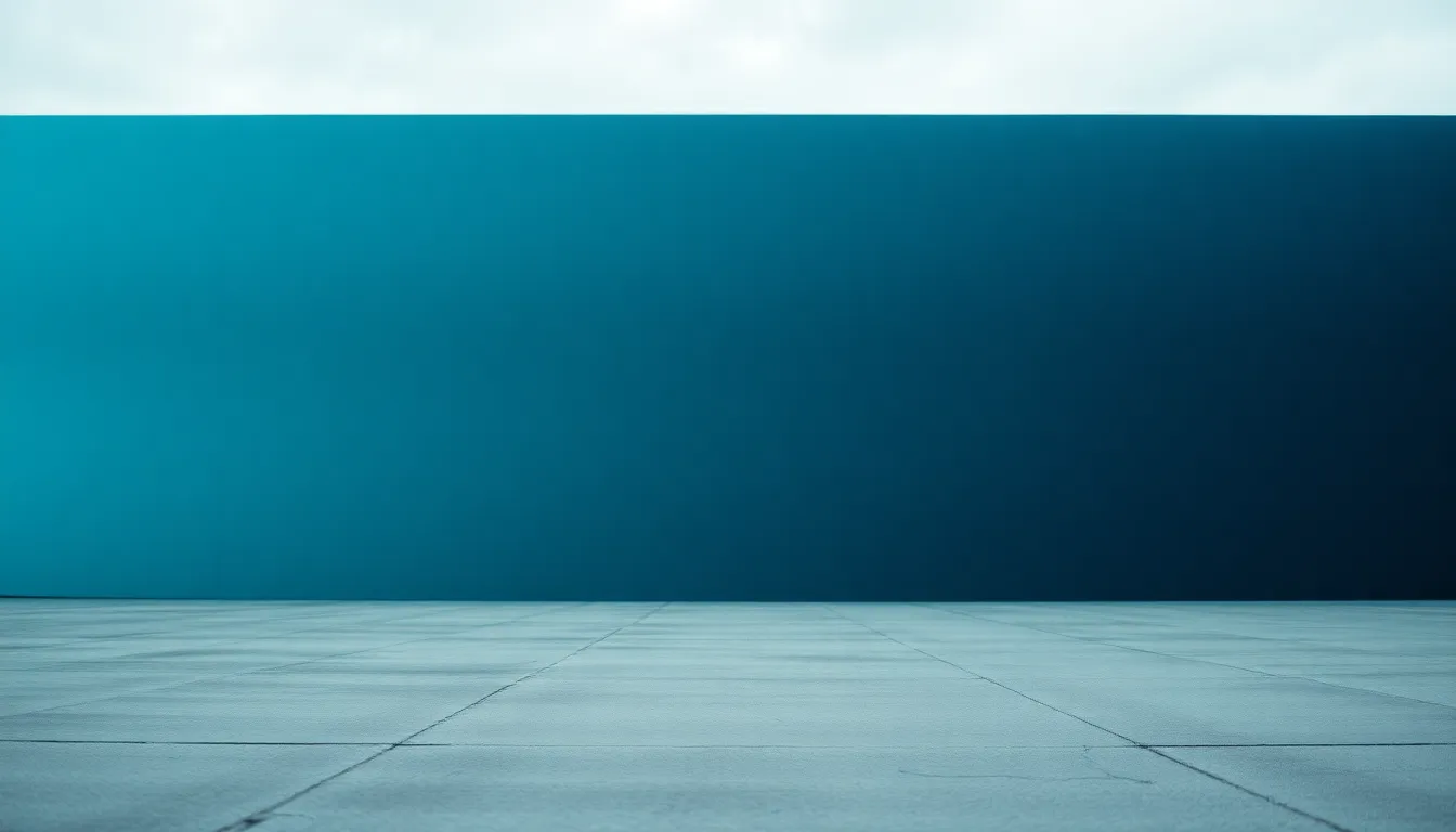 This sophisticated image presents a seamless gradient transitioning from a calming teal to a deep navy. Illuminated by overcast daylight, the serene colors evoke a sense of tranquility and depth. The smooth concrete surface beneath adds an interesting texture, while the leading lines work beautifully in guiding the viewer's eye through the color blend. The muted tones create a sophisticated ambiance, perfect for modern design.