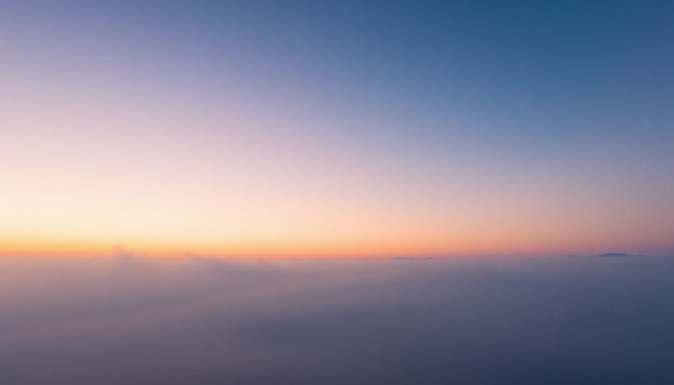 Majestic Mountain Range at Sunset Gradient This breathtaking landscape captures the majestic gradient of the sky as it transitions from deep blue to delicate pink during sunset over a stunning mountain range. The image employs dappled sunlight, enhancing the texture of the clouds and mountains with dramatic contrasts. The hyperfocal depth of field ensures clarity throughout, drawing viewers' eyes along the valley's leading lines toward the peaks. The serene color palette evokes a sense of calm and wonder at nature's beauty.