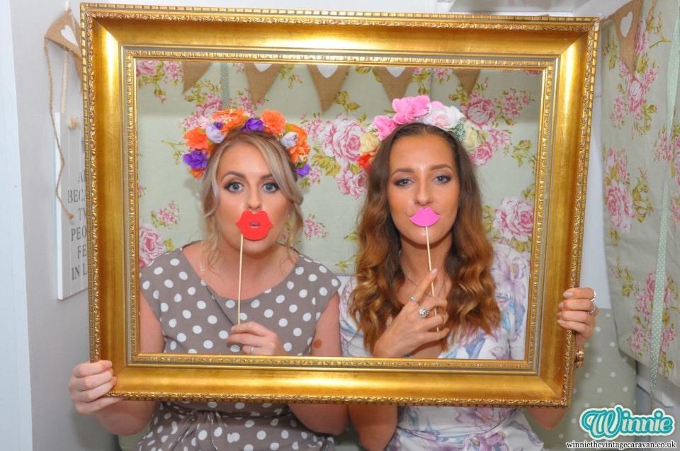 Photo from a wedding featuring bride and bridesmaid